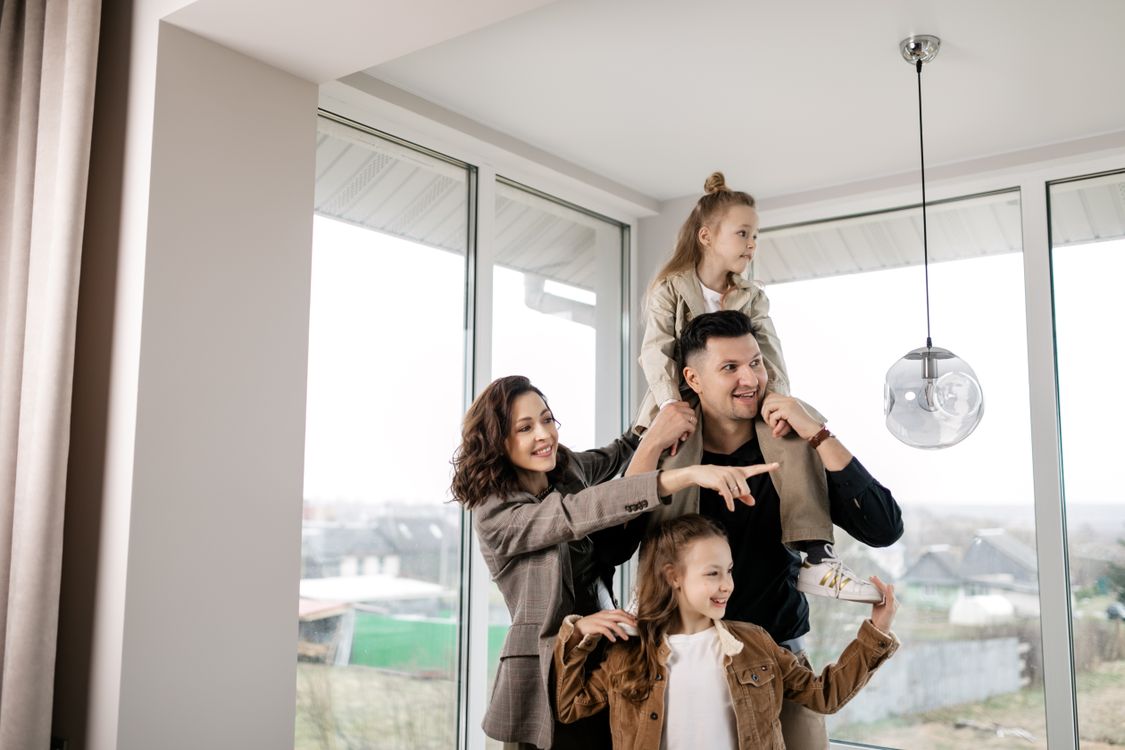 A family celebrating together inside their new home